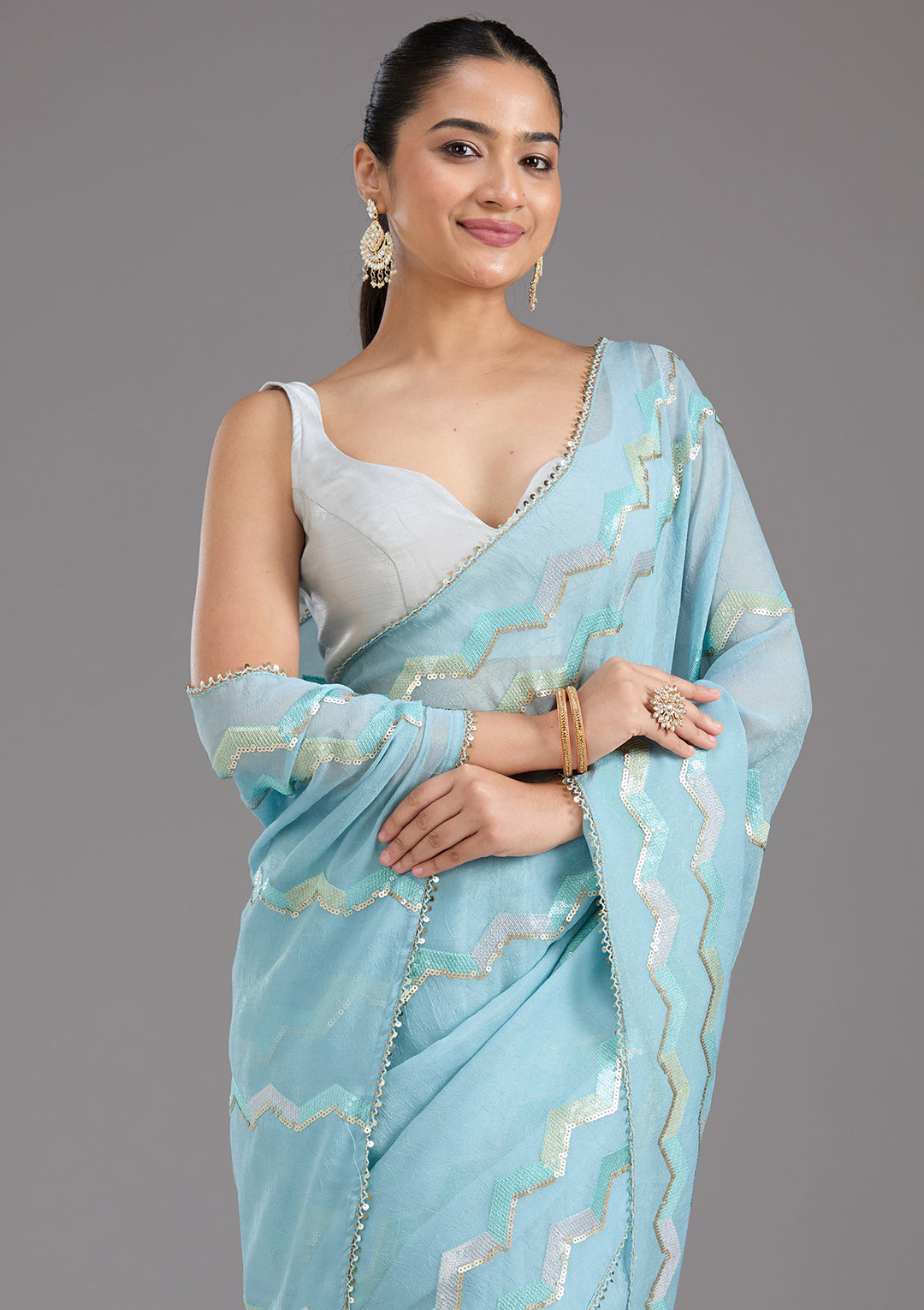 Sky Blue Sequins Semi Crepe Saree