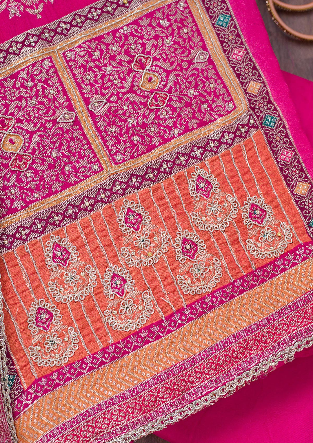 Rani Pink Cutdana Semi Crepe Unstitched Salwar Suit