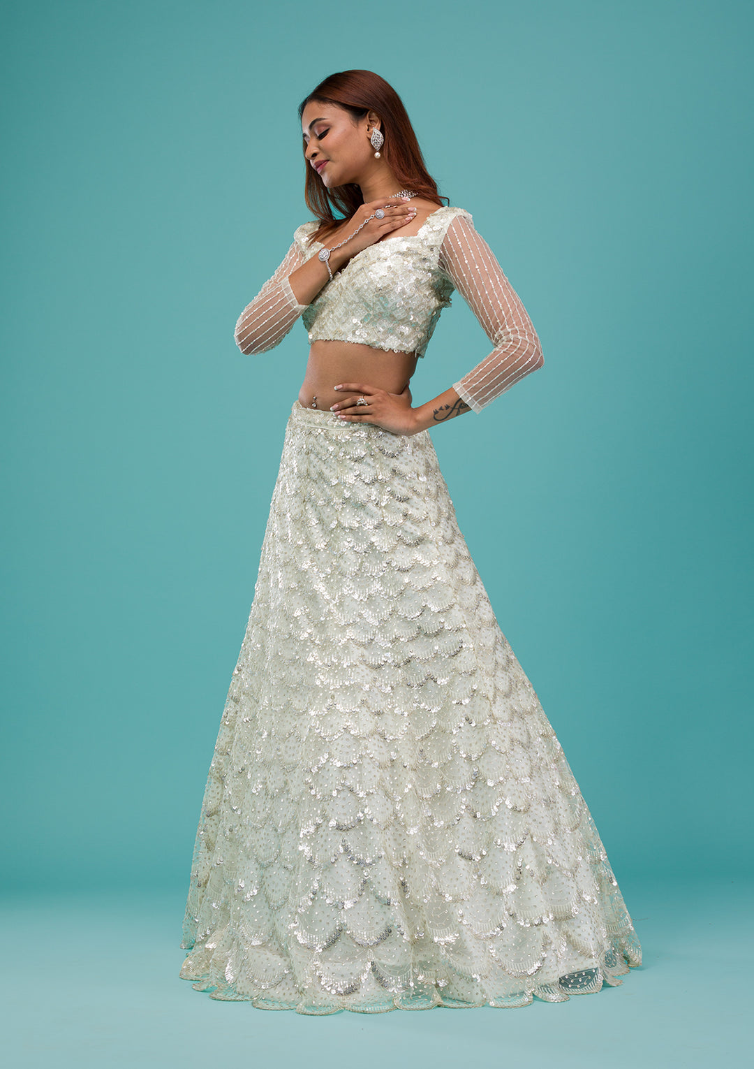 Cream Sequins Net Semi Stitched Lehenga
