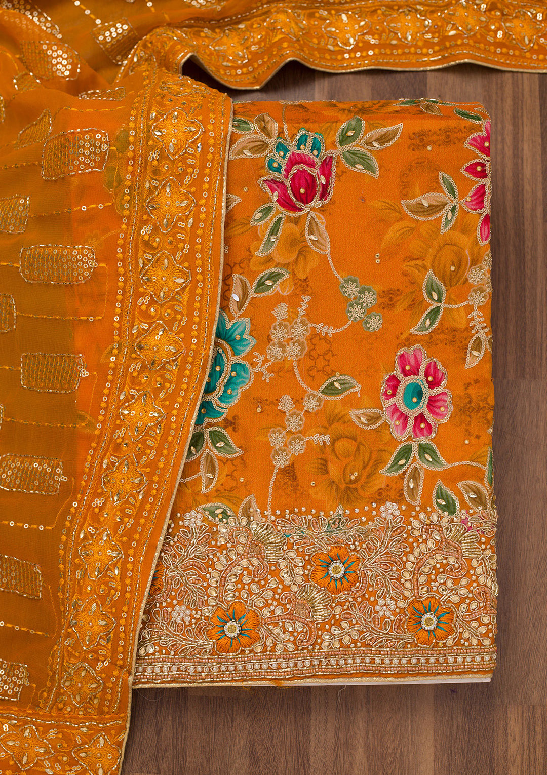 Orange Printed Semi Crepe Unstitched Salwar Suit