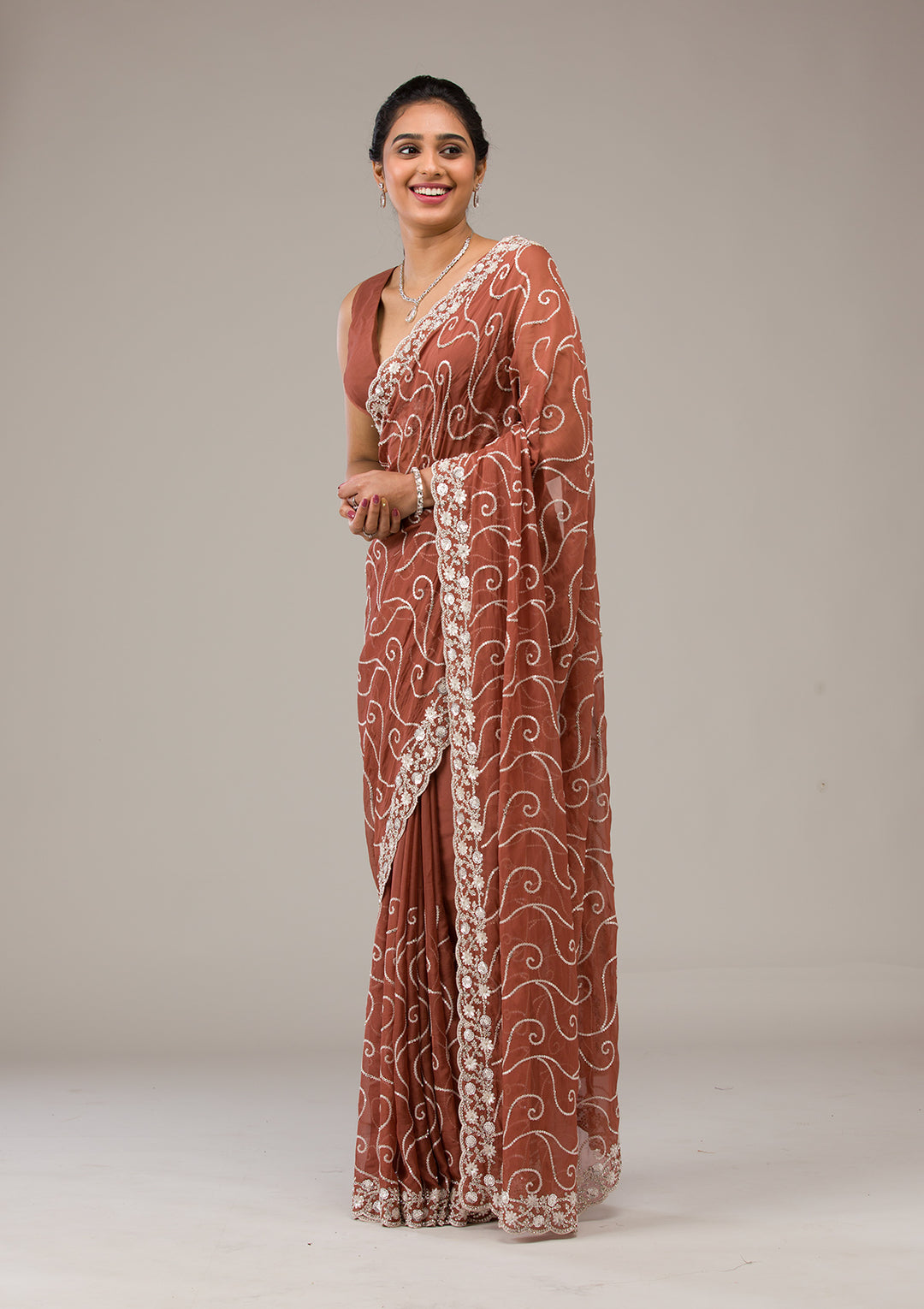 Rust Sequins Georgette Saree
