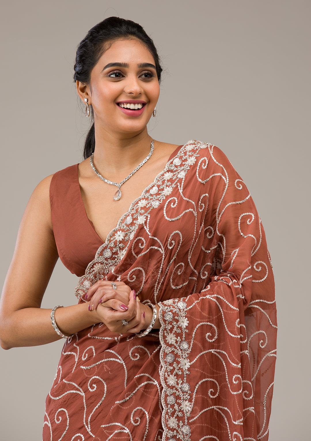 Rust Sequins Georgette Saree