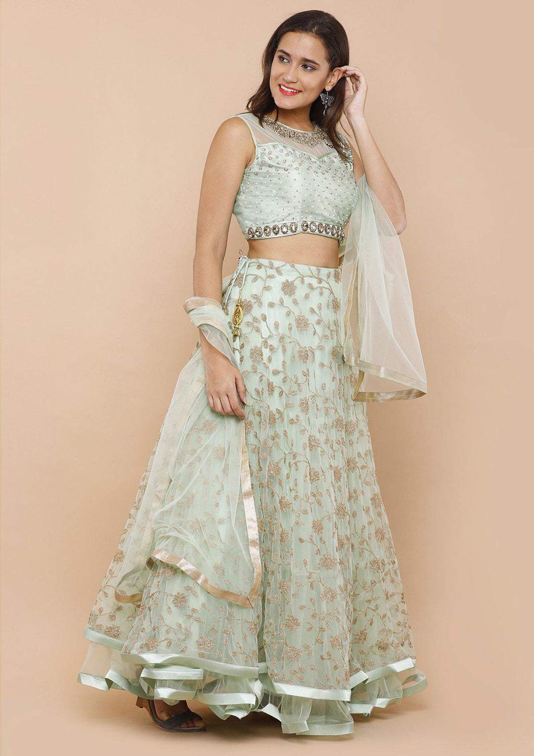 koskii seafoam green and gold net lehenga-Koskii