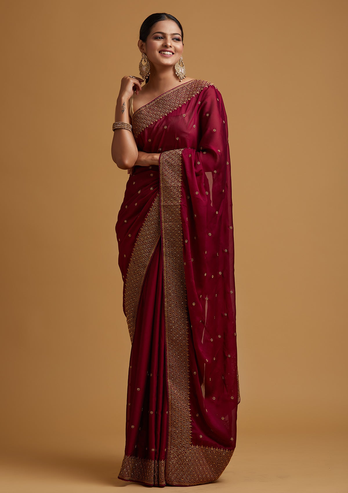 Wine coloured maheshwari silk saree with gold red zari border